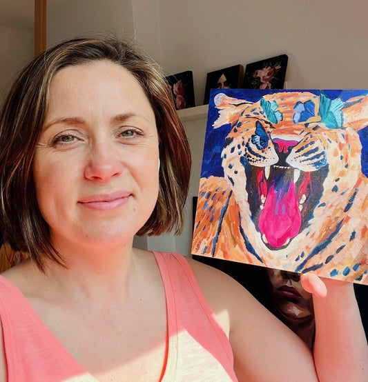 Louise holding tiger painting