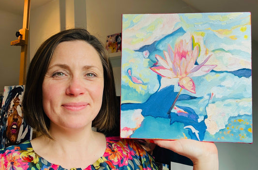 Louise holding a waterlily painting