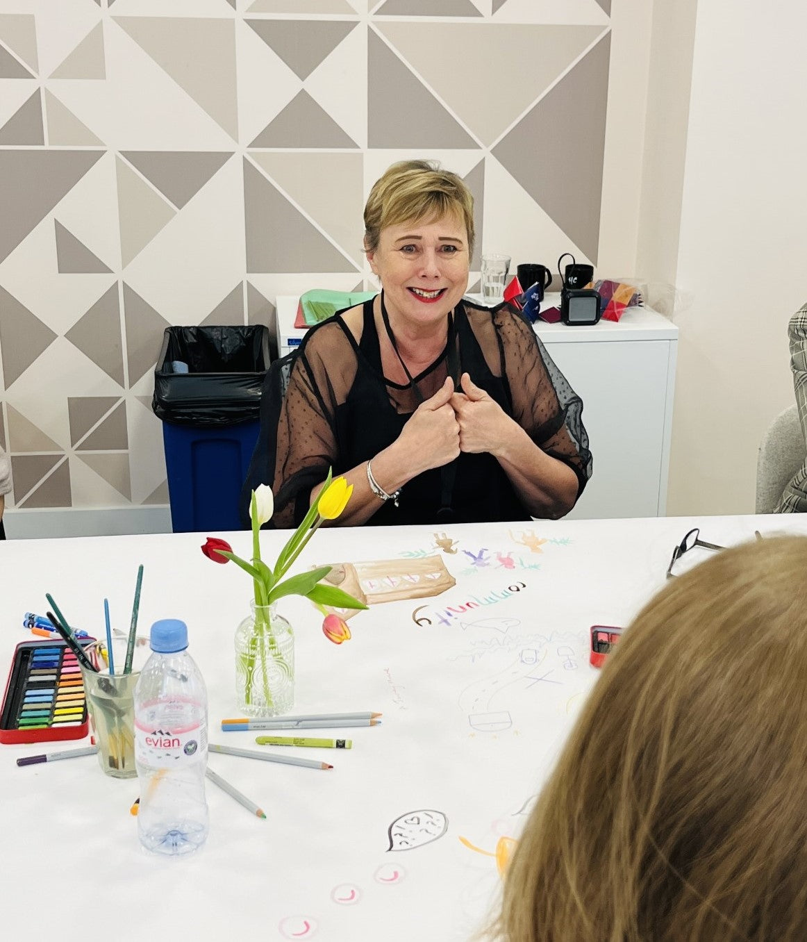 Lady in workshop at shared canvas in Financial Times office London